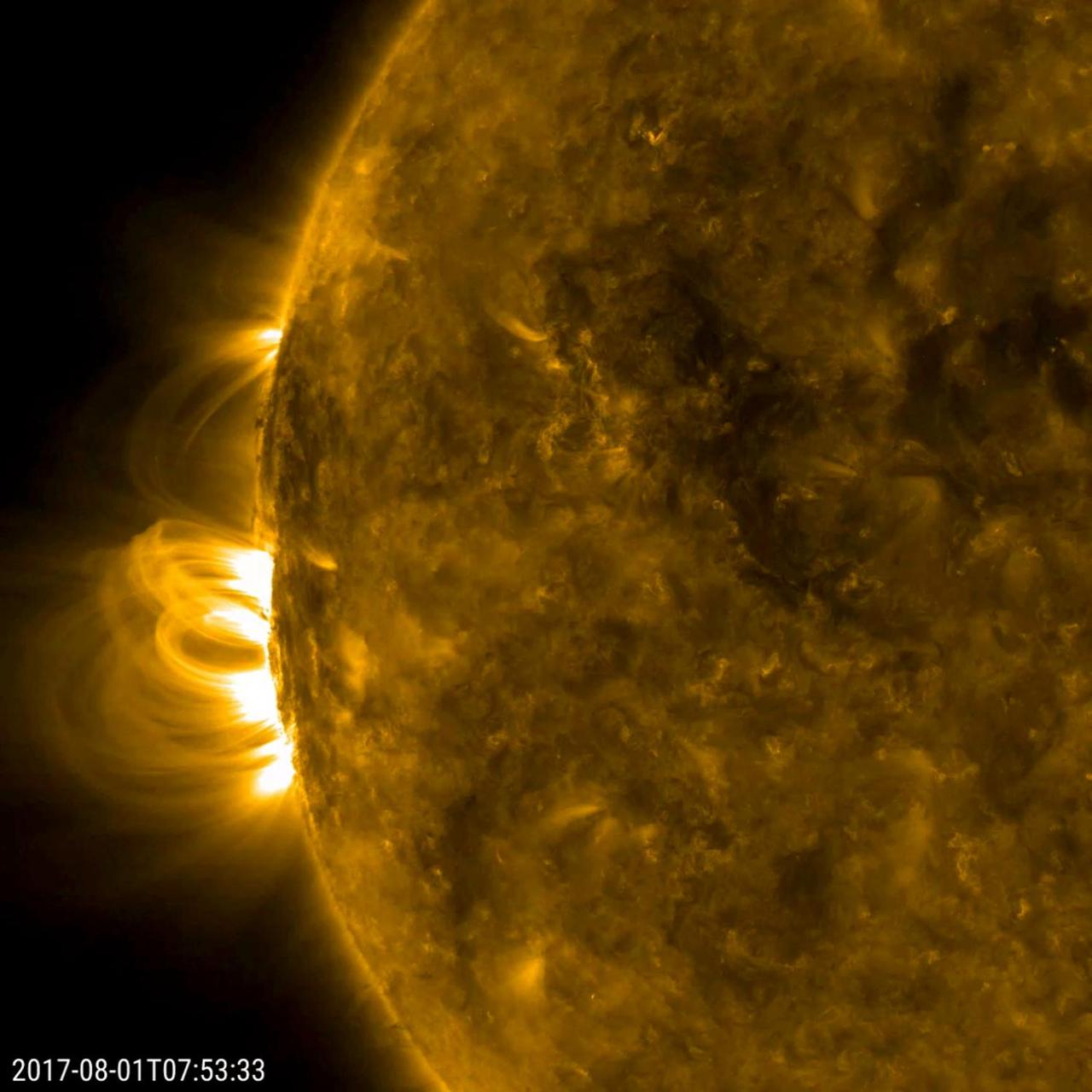 Close-up view of a large dark sunspot group on the granulated surface of the Sun.